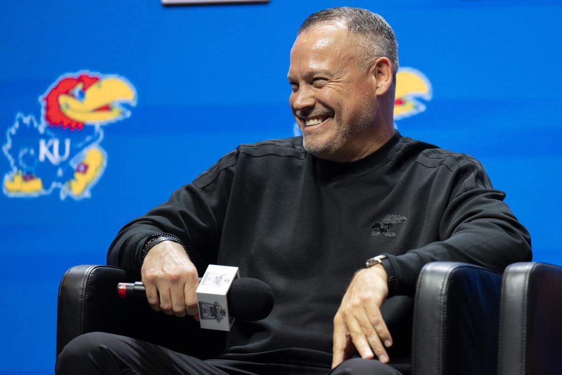 Kansas Jayhawks head coach Brandon Schneider smiles while taking questions from reporters during Big 12 Media Days at T-Mobile Center on Tuesday, Oct. 21, 2025, in Kansas City.