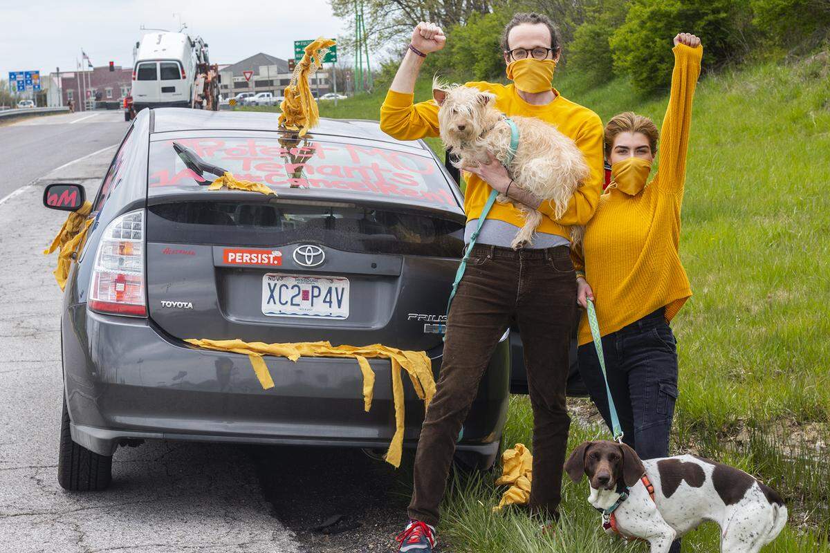 Aaron Loker, left, and Deanne Lyons, of Rolla, were part of the Coalition to Protect Missouri Tenants’ protest on Interstate 70 on Monday. The group wants Gov. Mike Parson to enact protections for residents during the coronavirus pandemic.