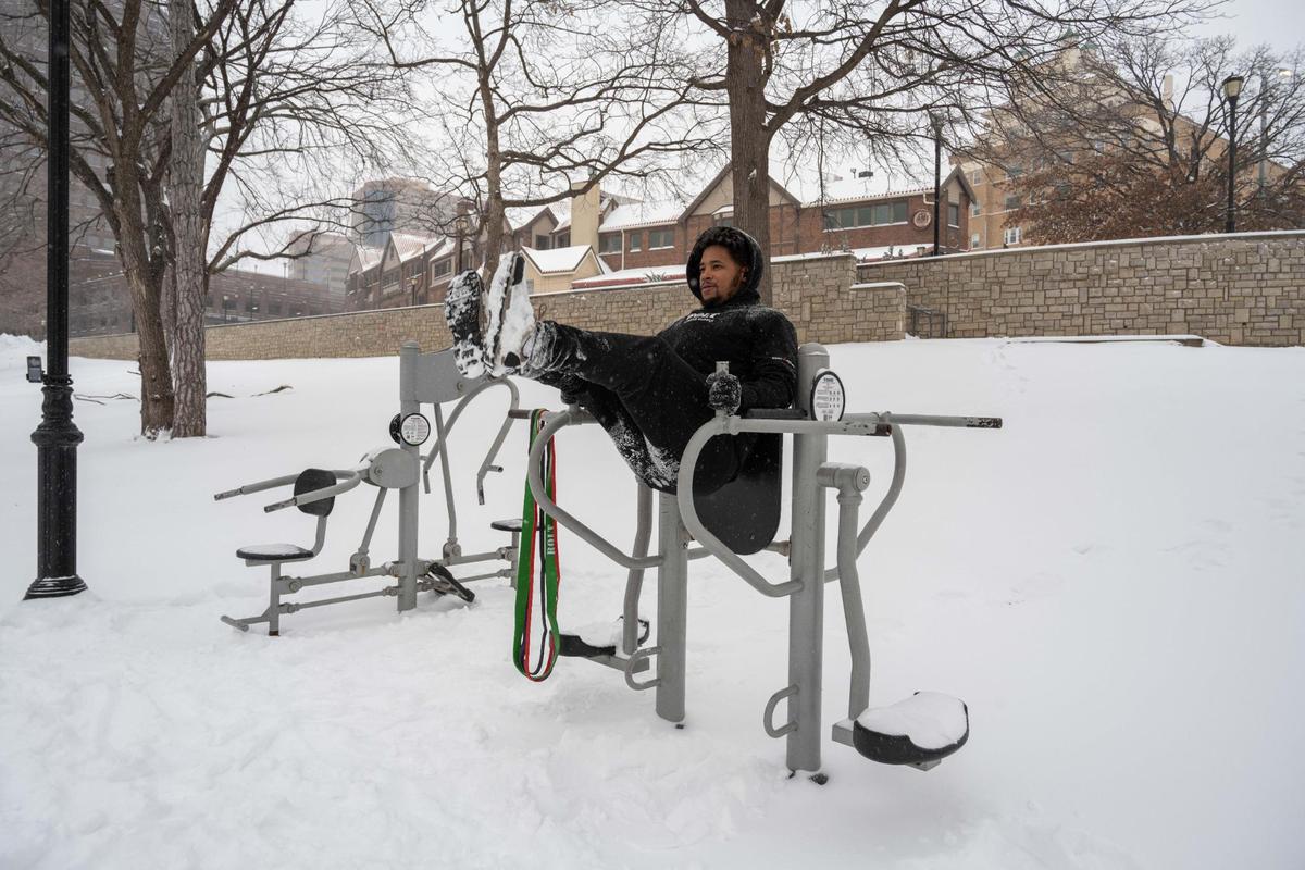 Jordan Simpson works out in the snow at Mill Street Park in Kansas City on Sunday, Jan. 5, 2025. Simpson was in town visiting from Dallas, Texas and said “we don’t get snow like this down there.”