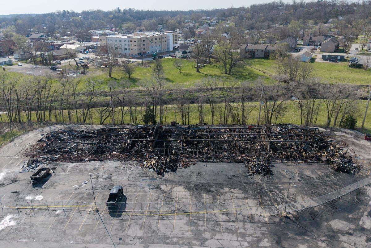 The skeletal remains of a Smithville shopping center stand in ruin on Tuesday, March 31, 2026, less than 24 hours after a massive fire destroyed five businesses. The Monday afternoon blaze destroyed Smithville's Pizza Shoppe, La Fuente Mexican Restaurant, H&R Block, Westlake Chinese Restaurant, and Lakeside Smoke.