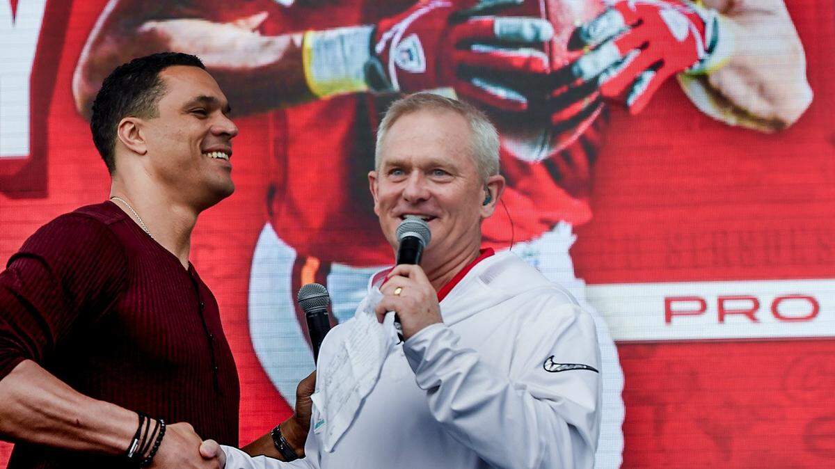 Retired Chiefs tight end Tony Gonzalez, left, greets Chiefs play-by-play announcer Mitch Holthus during a Super Bowl LIV rally several years ago in downtown Miami.