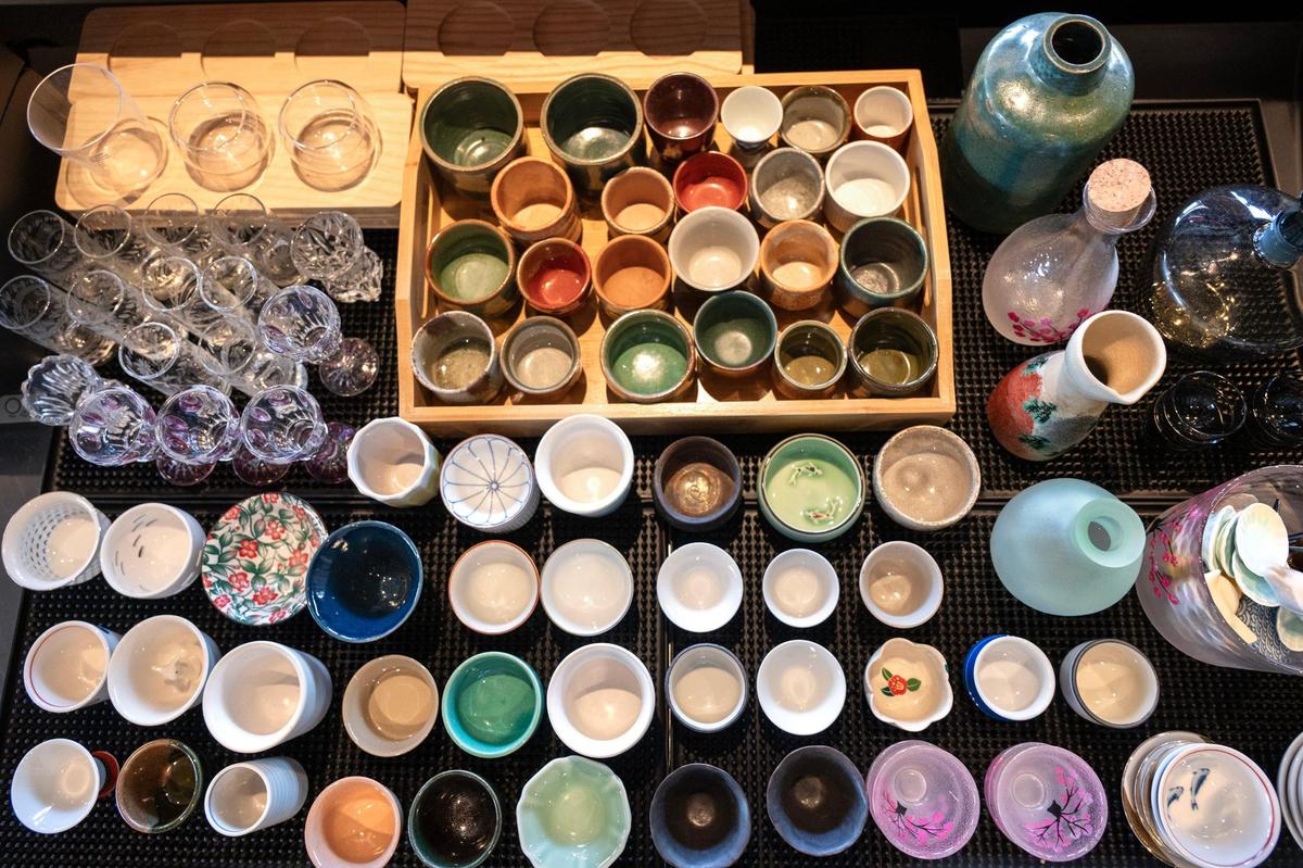 A variety of sake cups and vessels will be used to serve sake at Anjin, a Japanese bar and restaurant, 1708 Oak St. The restaurant is opening in July from the founders of the Antler Room.