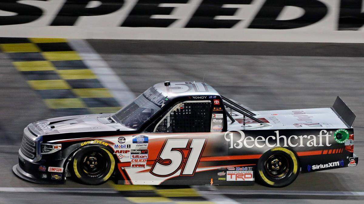 Kyle Busch (51) crosses the finish line for the win during a NASCAR Truck Series auto race at Kansas Speedway in Kansas City, Kan., Saturday, May 1, 2021. 