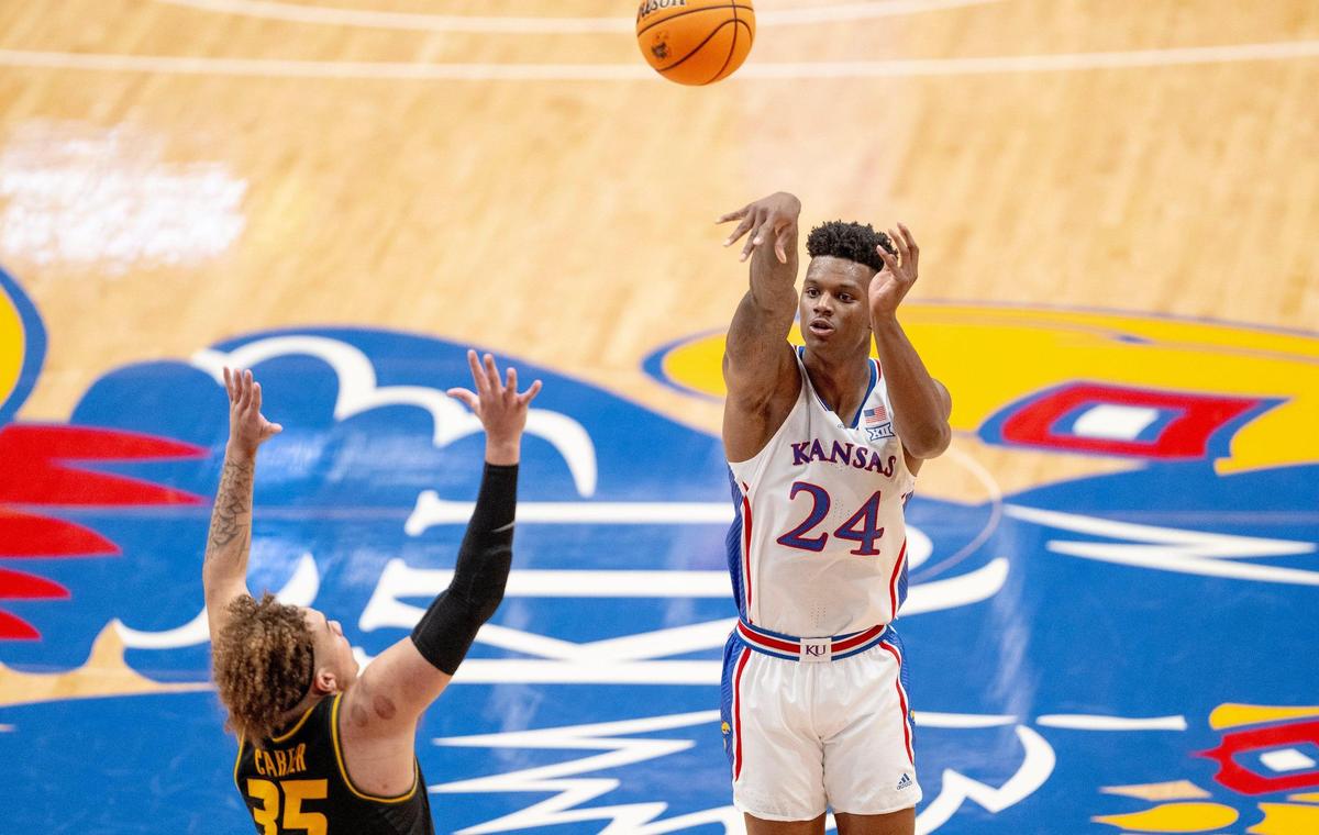 Kansas Jayhawks forward K.J. Adams Jr. (24) shoots the ball over Missouri Tigers forward Noah Carter (35) during an NCAA basketball game on Saturday, Dec. 9, 2023, in Lawrence, Kan.