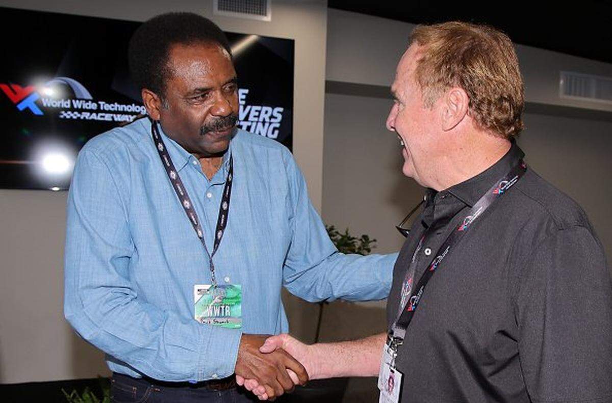 David Steward, co-founder of World Wide Technology (L) shakes hands with NASCAR Hall of Famer Rusty Wallace in this 2023 file photo.