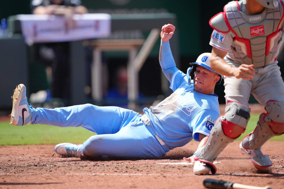 Kansas City Royals outfielder Isaac Collins slides home safely in the fifth inning at Kauffman Stadium on July 05, 2026 in Kansas City, Missouri.