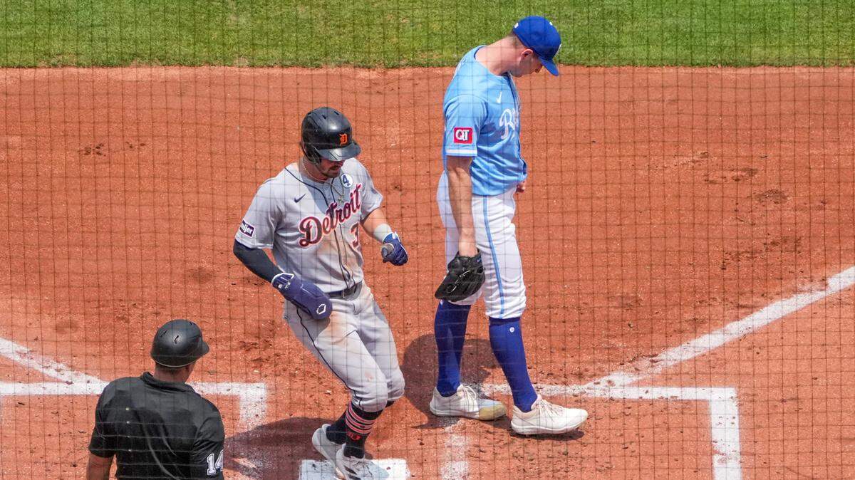 Kansas City Royals starting pitcher Kris Bubic (50) looks away as Detroit Tigers shortstop Zach McKinstry (39) scores in the third inning at Kauffman Stadium on June 1, 2025, in Kansas City.