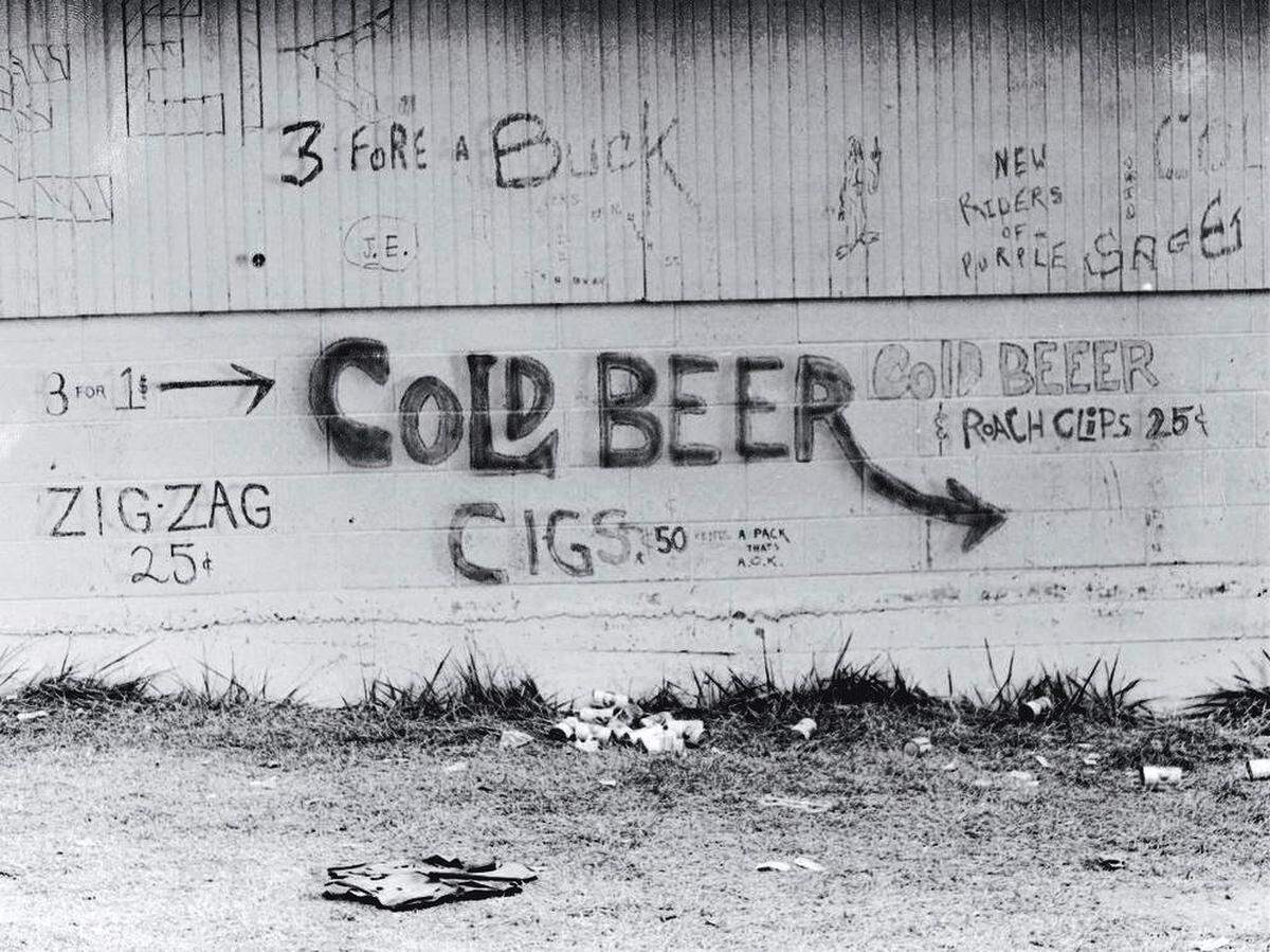 Structures on the Missouri State Fairgrounds in Sedalia became makeshift billboards to advertise everything from cold beer to rolling paper to roach clips during 1974’s Ozark Music Festival.