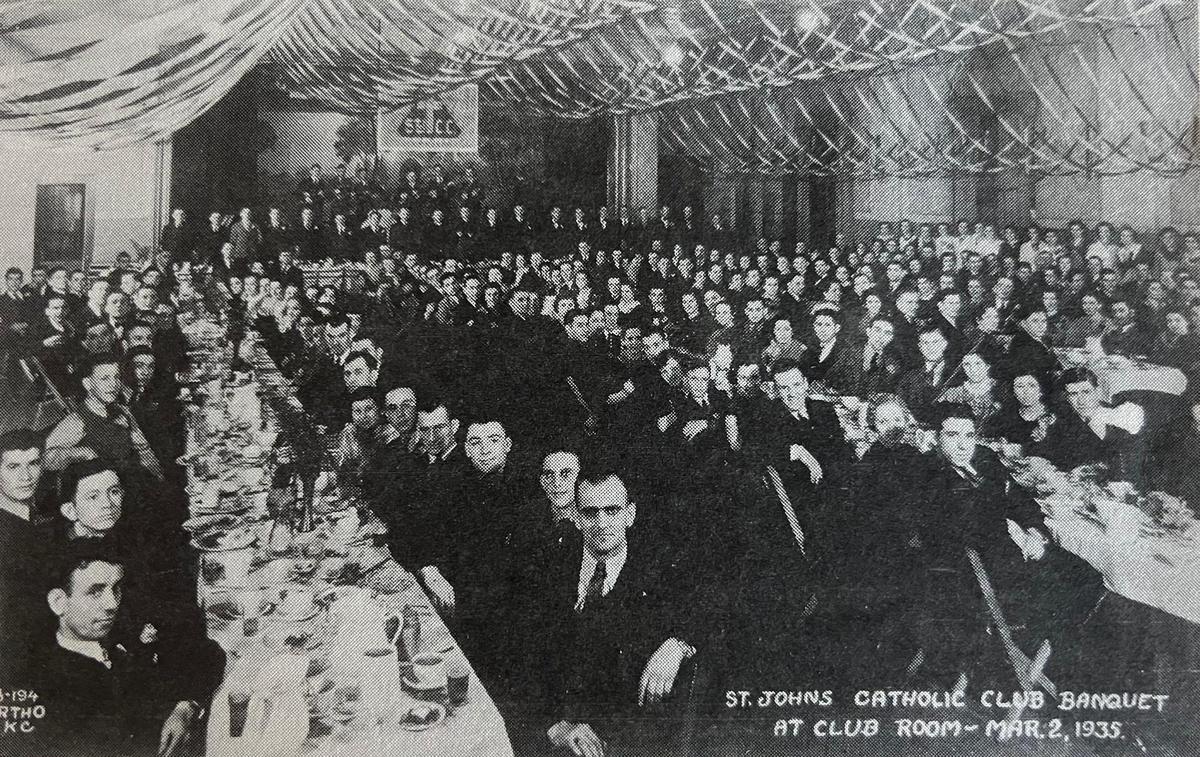 A photo taken on March 2, 1935, shows a full house at the St. John Catholic Club banquet in the club room.