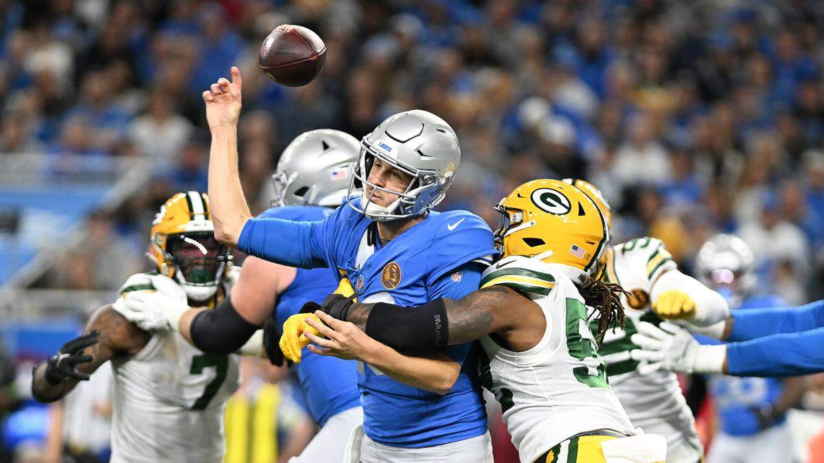 Nov 23, 2023; Detroit, Michigan, USA; Detroit Lions quarterback Jared Goff (16) fumbles the ball while being hit by Green Bay Packers linebacker Rashan Gary (52) in the first quarter at Ford Field. Goff’s fumble was recovered by Green Bay Packers safety Jonathan Owens (34) and returned for a touchdown.