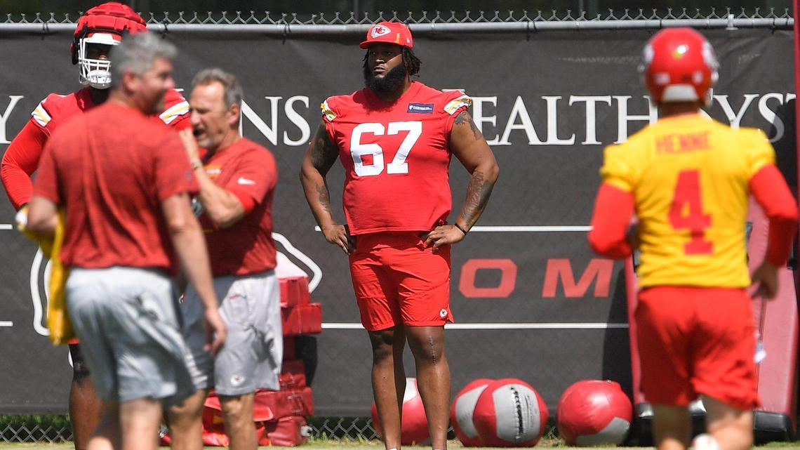 Lucas Niang (67) watches his teammates participate in Tuesday’s mini-camp at the Chiefs’ practice facility.