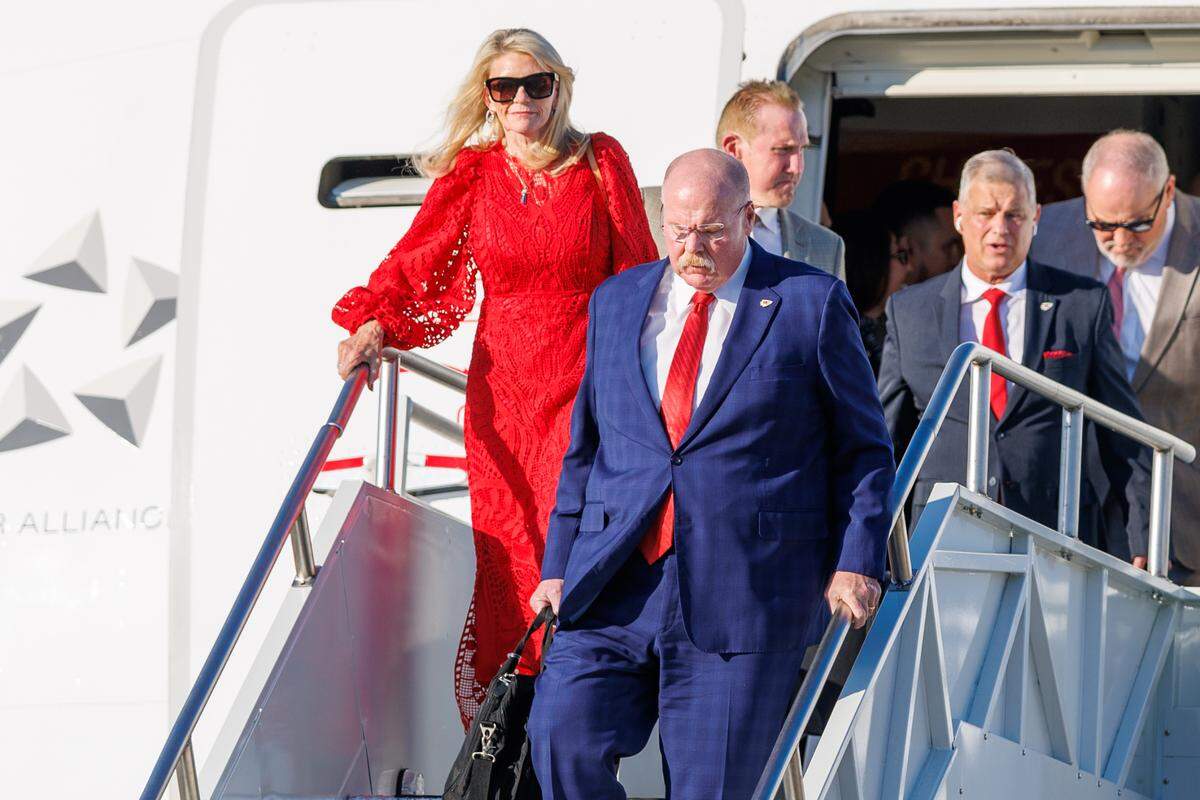 Kansas City Chiefs head coach Andy Reid and his wife Tammy Reid exit the plane after arriving at Louis Armstrong New Orleans International Airport on Feb. 2, 2025.