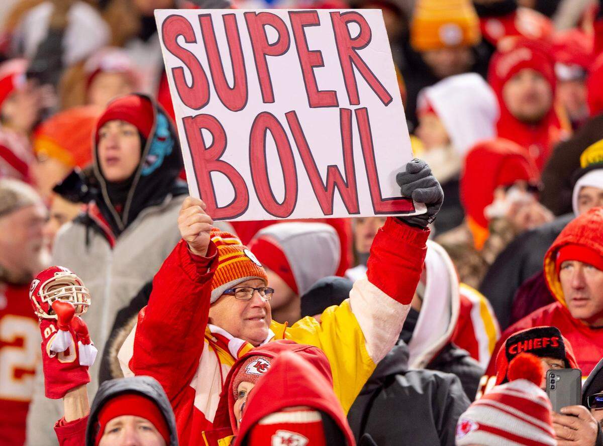 A Kansas City Chiefs fan holds up a sign reading “Super Bowl” after the Chiefs defeated the Cincinnati Bengals 23-20 in the AFC Championship in January.