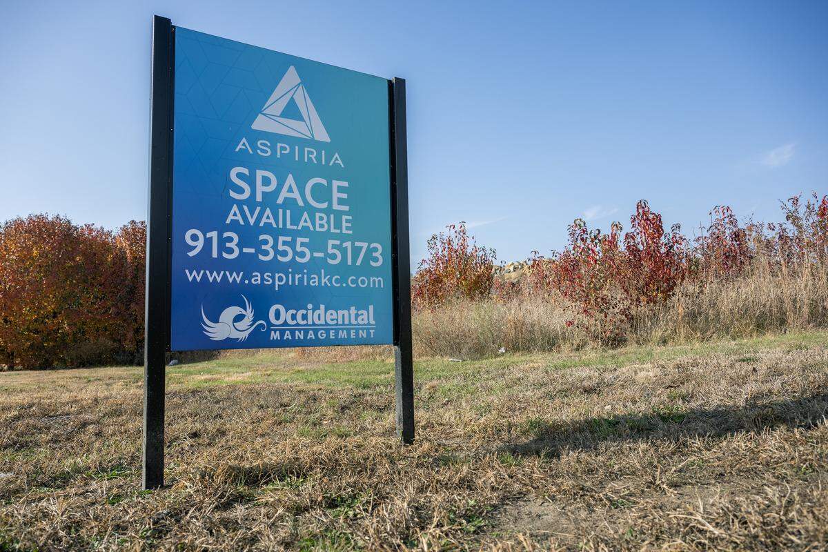 A sign from Aspiria stands on a vacant plot along West 119th Street and Nall Avenue on Wednesday, Nov. 19, 2025, in Leawood.