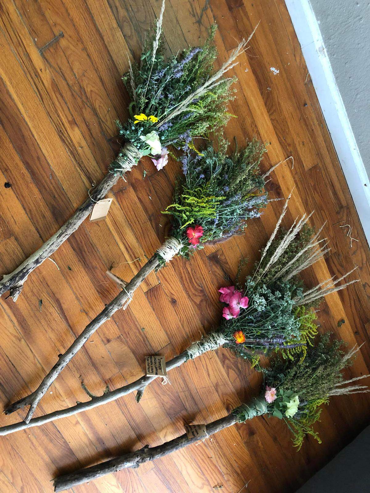 Taylor Pond crafts her broomsticks from wood foraged throughout Kansas City, along with plants and herbs such as sage, lavender, roses, goldenrod and cinnamon.