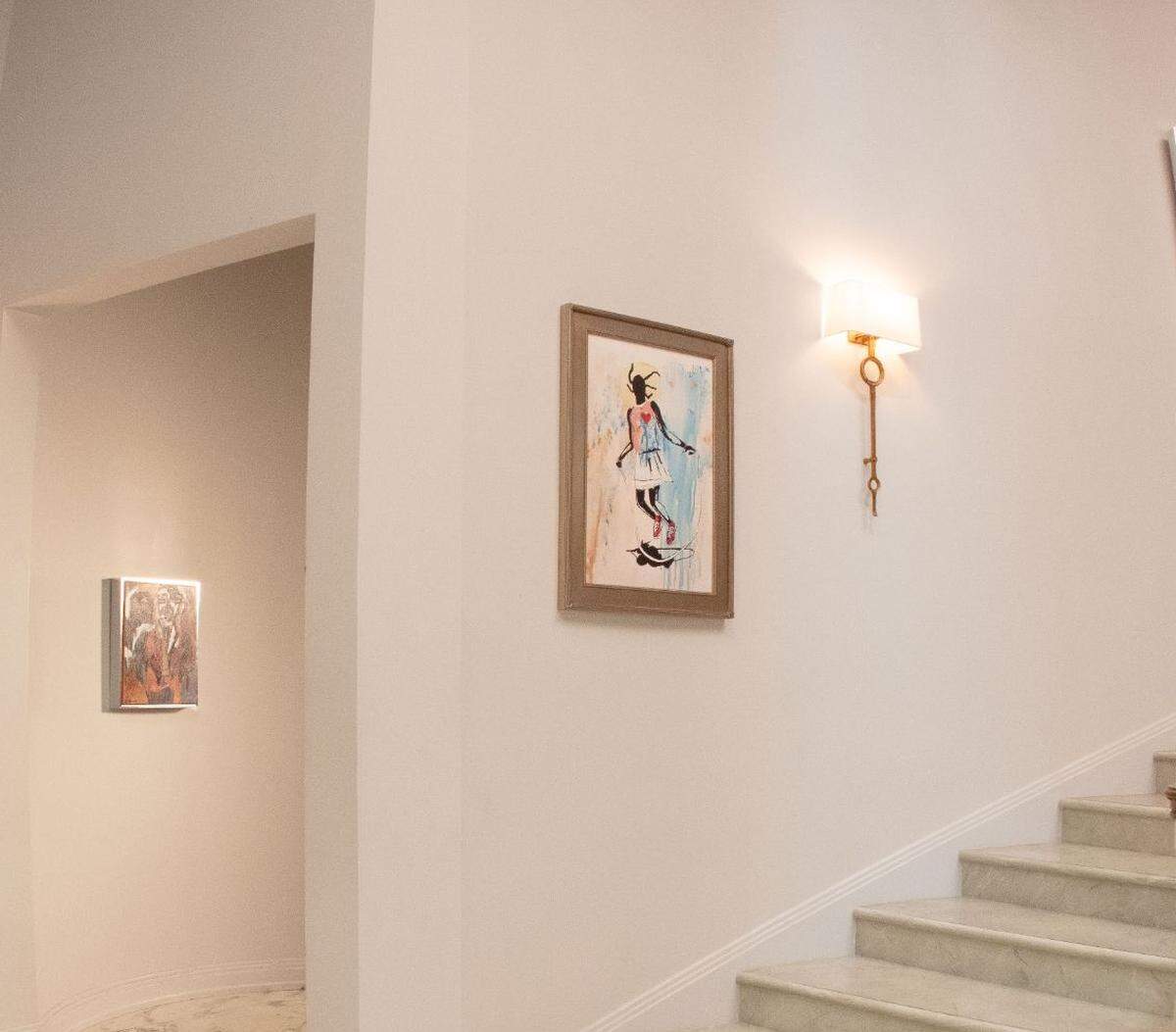 One of Jason Wilcox’s paintings hangs in the foyer of the “Bel-Air” mansion.