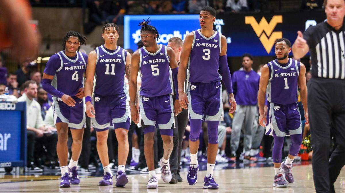 Kansas State Wildcats players walk onto the court after a timeout during the second half against the West Virginia Mountaineers at WVU Coliseum on March 4, 2023.