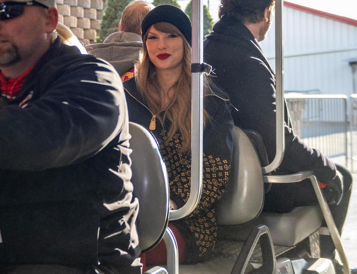 Pop star Taylor Swift is escorted by security on a golf cart to attend the AFC Championship Game between the Kansas City Chiefs and the Buffalo Bills on  Jan. 26, 2025, at GEHA Field at Arrowhead Stadium.