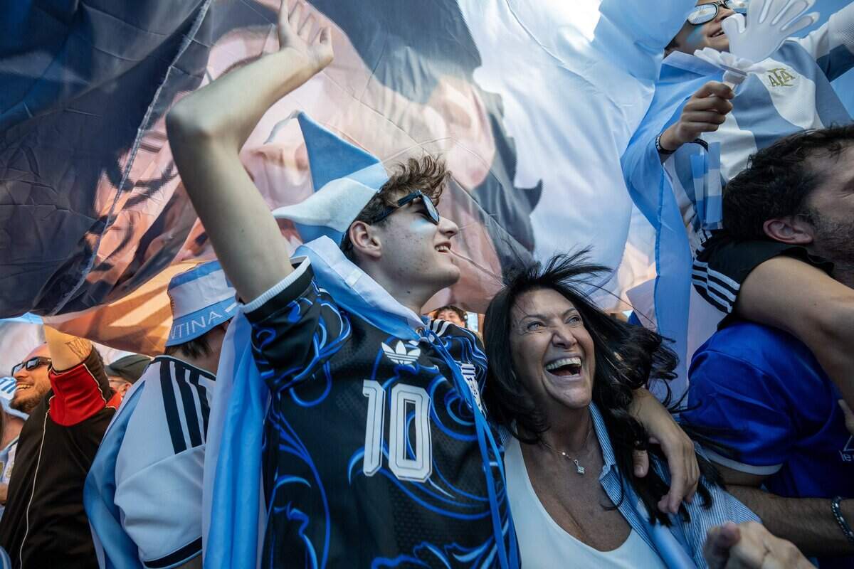 Argentina supporters celebrate during a pregame gathering ahead of Argentina's FIFA World Cup match against Algeria at Mill Creek Park on Monday, June 15, 2026, in Kansas City.