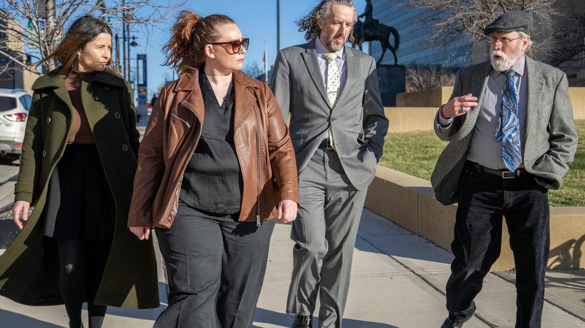 Nicole Gordon, left, Quinn O’Brien, Brian Russell and Sean O’Brien walk past the Jackson County courthouse on Wednesday, Jan. 31, 2024, in Kansas City. The legal team says they have serious doubts about the conviction of their client Byron Case and that his case should have been reviewed by Jackson County prosecutors.