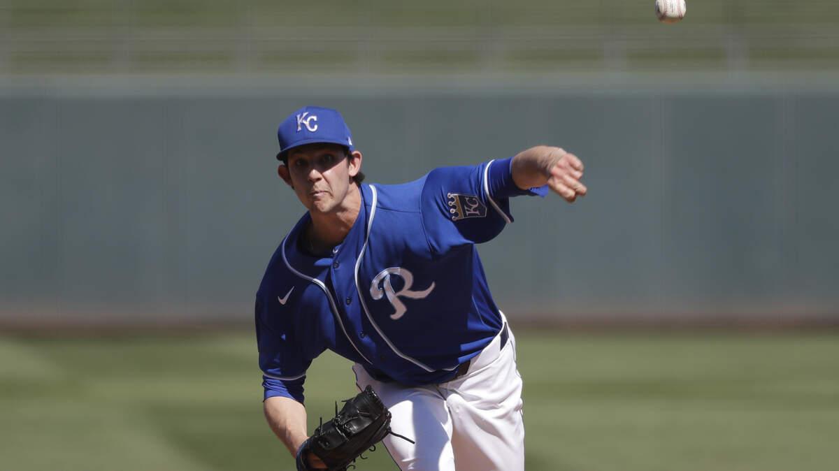 Kansas City Royals starting pitcher Daniel Lynch throws against the Los Angeles Angels during a spring training baseball game Friday, March 6, 2020, in Surprise, Ariz. (AP Photo/Elaine Thompson)