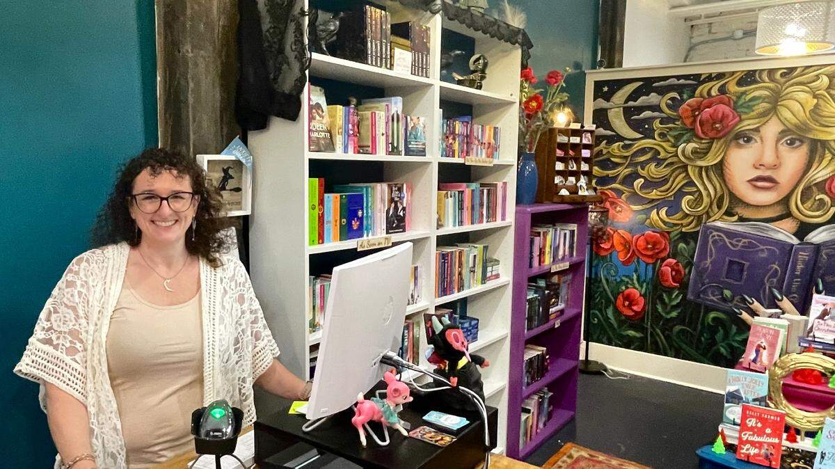 Carley Morton is the owner of Under the Cover, a romance novel bookstore that opened Wednesday in midtown.