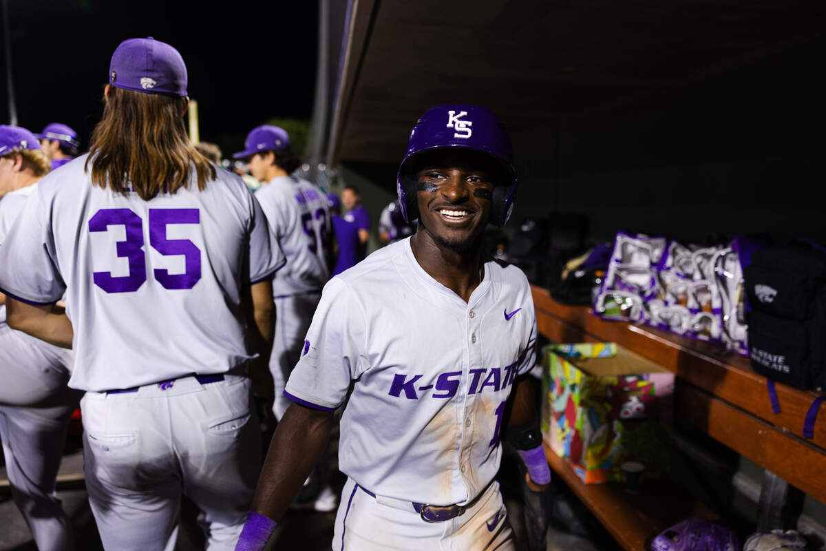 Kansas State Wildcats star Dondreone “Dee” Kennedy smiles in the dugout during a 2026 Big 12 baseball game against Utah.