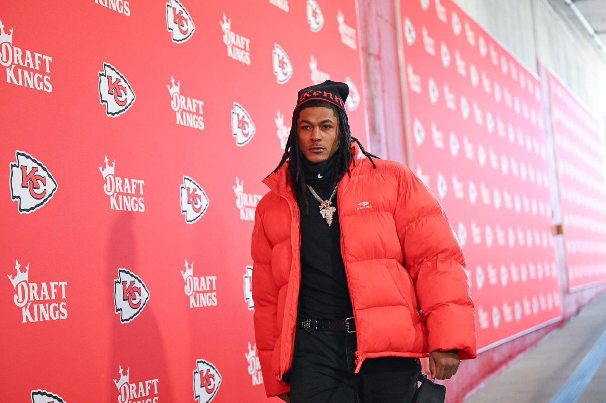 Running back Isiah Pacheco returned for duty in an oversized puffer coat in Chiefs red.