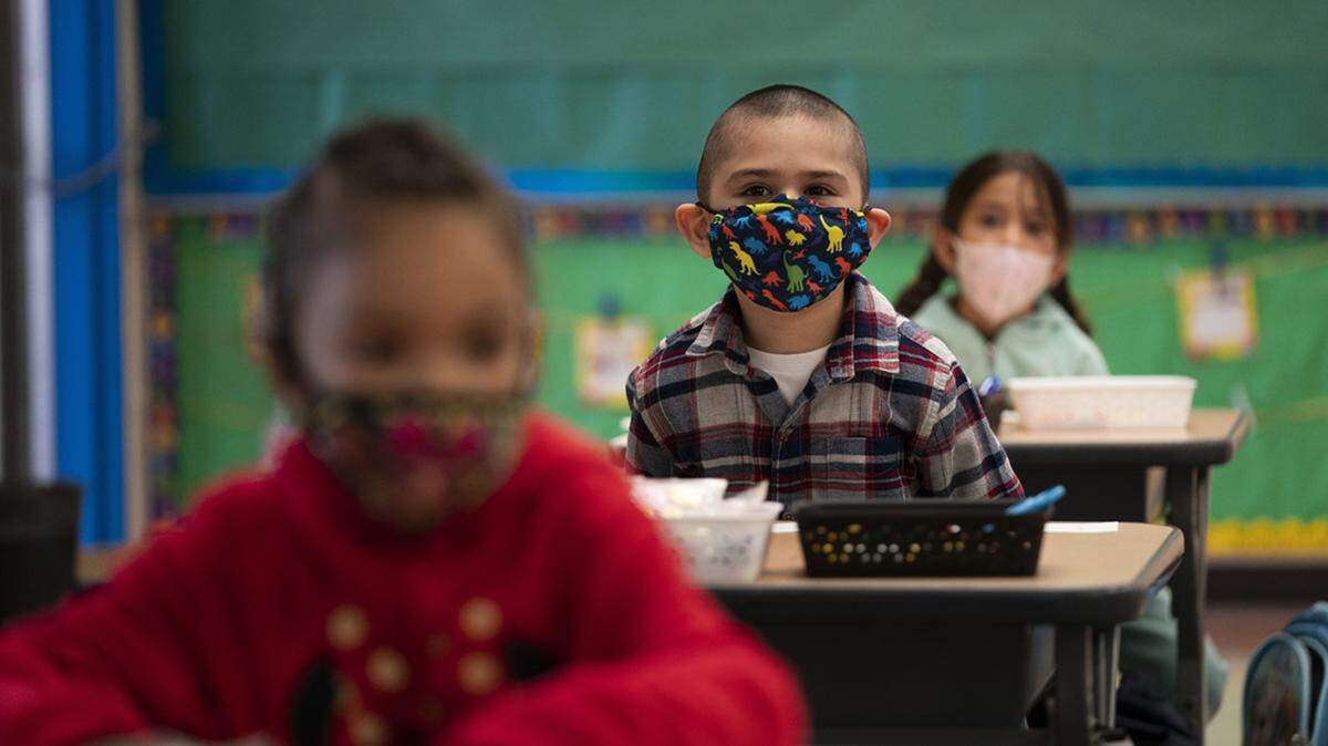 Kansas City area school district drops COVID mask rule. School board was 1 vote short