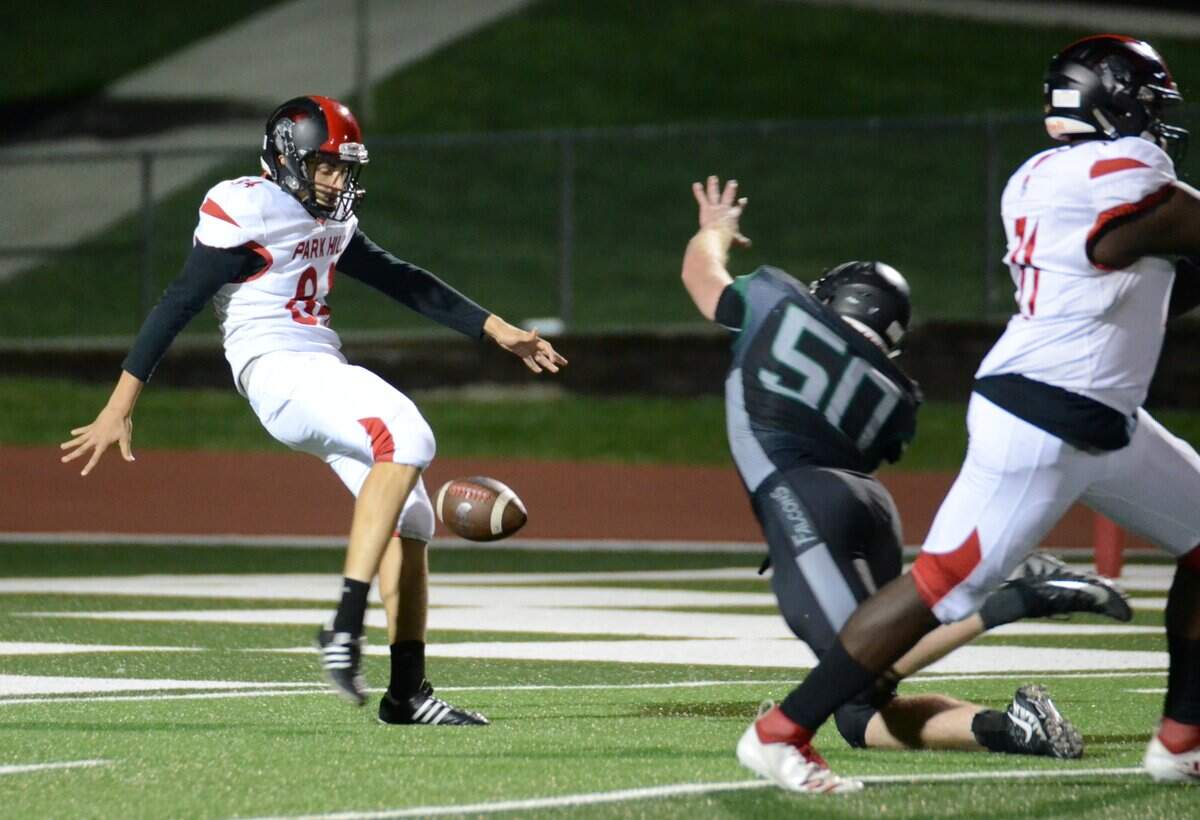 Staley’s Hayden Gregg, No. 50, blocks a punt against Park Hill in October on a play that turned the tide of the game for the Falcons as Staley came back to win 13-10.
