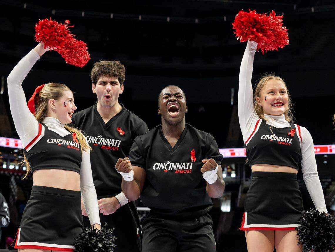 Cincinnati Bearcats cheerleaders yell after defeating Utah Utes 73-66 in a Big 12 Men's Basketball Tournament at T-Mobile Center on Tuesday, March 10, 2026, in Kansas City.