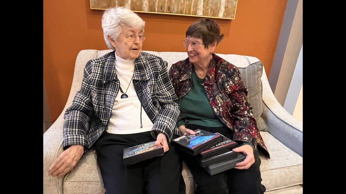 Library buddies Vaughnie Tinsley, left, and Darline Cyre are among the faithful patrons of the soon-to-be-closed Antioch Library. The two look forward to the new Merriam Plaza Library opening in March.
