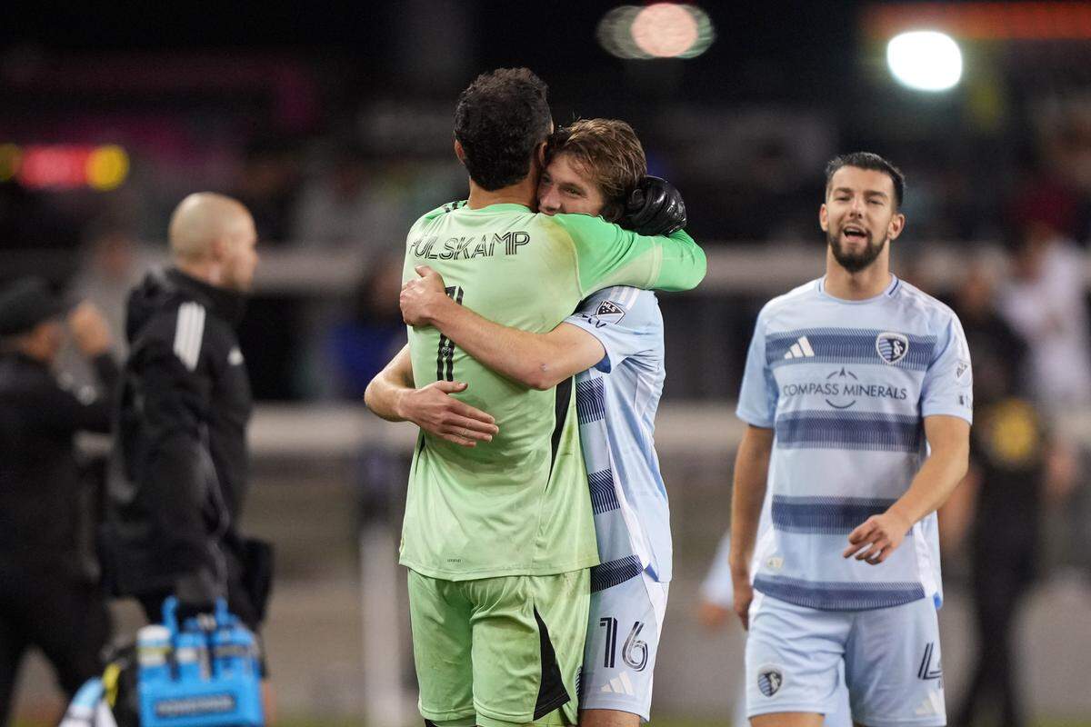Sporting Kansas City midfielder Jacob Bartlett (16) celebrates with goalkeeper John Pulskamp (1) after defeating the San Jose Earthquakes at PayPal Park on April 19, 2025.