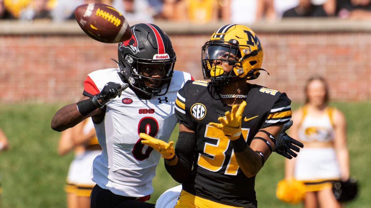 Missouri wide receiver D’ionte Smith, right, catches a touchdown pass in front of Southeast Missouri State defensive back Trai Hodges, left, during the first quarter of an NCAA college football game Saturday, Sept. 18, 2021, in Columbia, Mo. (AP Photo/L.G. Patterson)