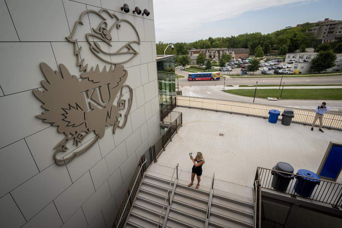 A large Jayhawk adorns a north wall of the renovated David Booth Kansas Memorial Stadium.