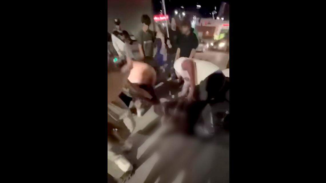 A fight captured on video in a parking lot outside of Power & Light on Aug. 24 escalated to a mass shooting in minutes. 2 were killed, 3 others injured in the fatal downtown KC shooting.