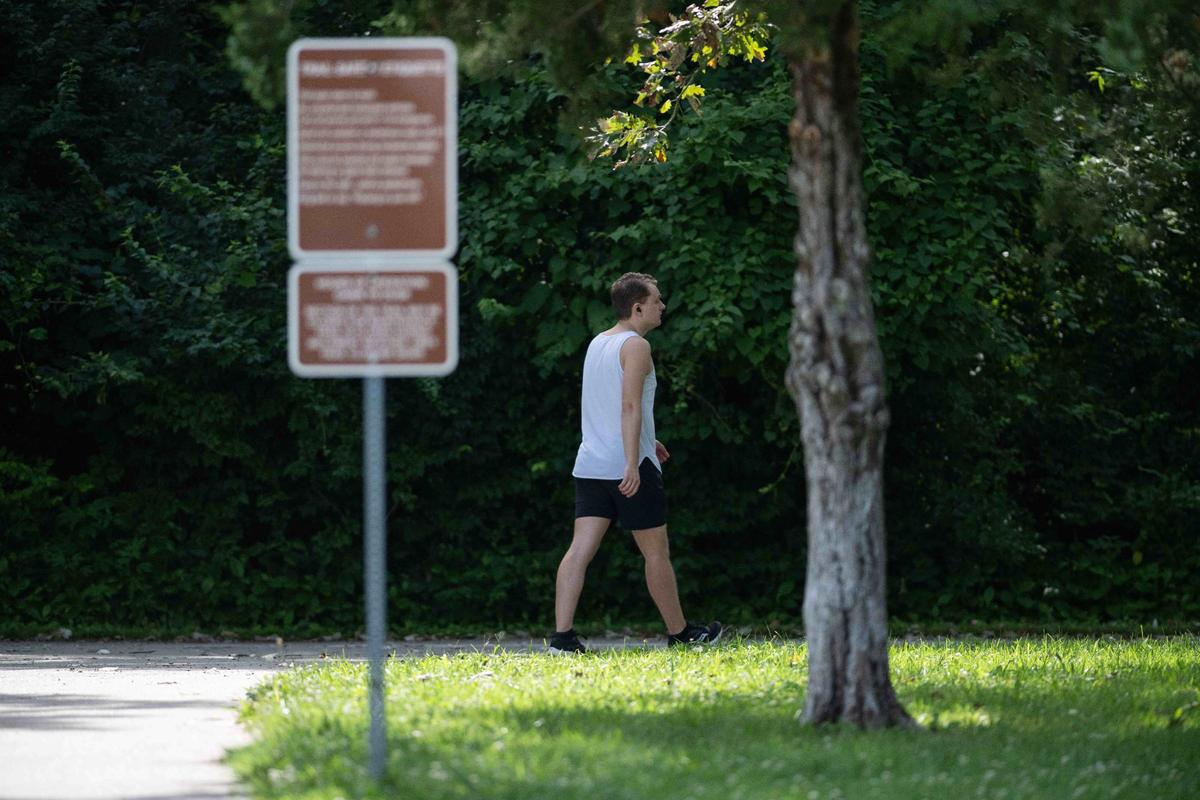 A person walks on Line Creek Trail, which is also popular with cyclists.