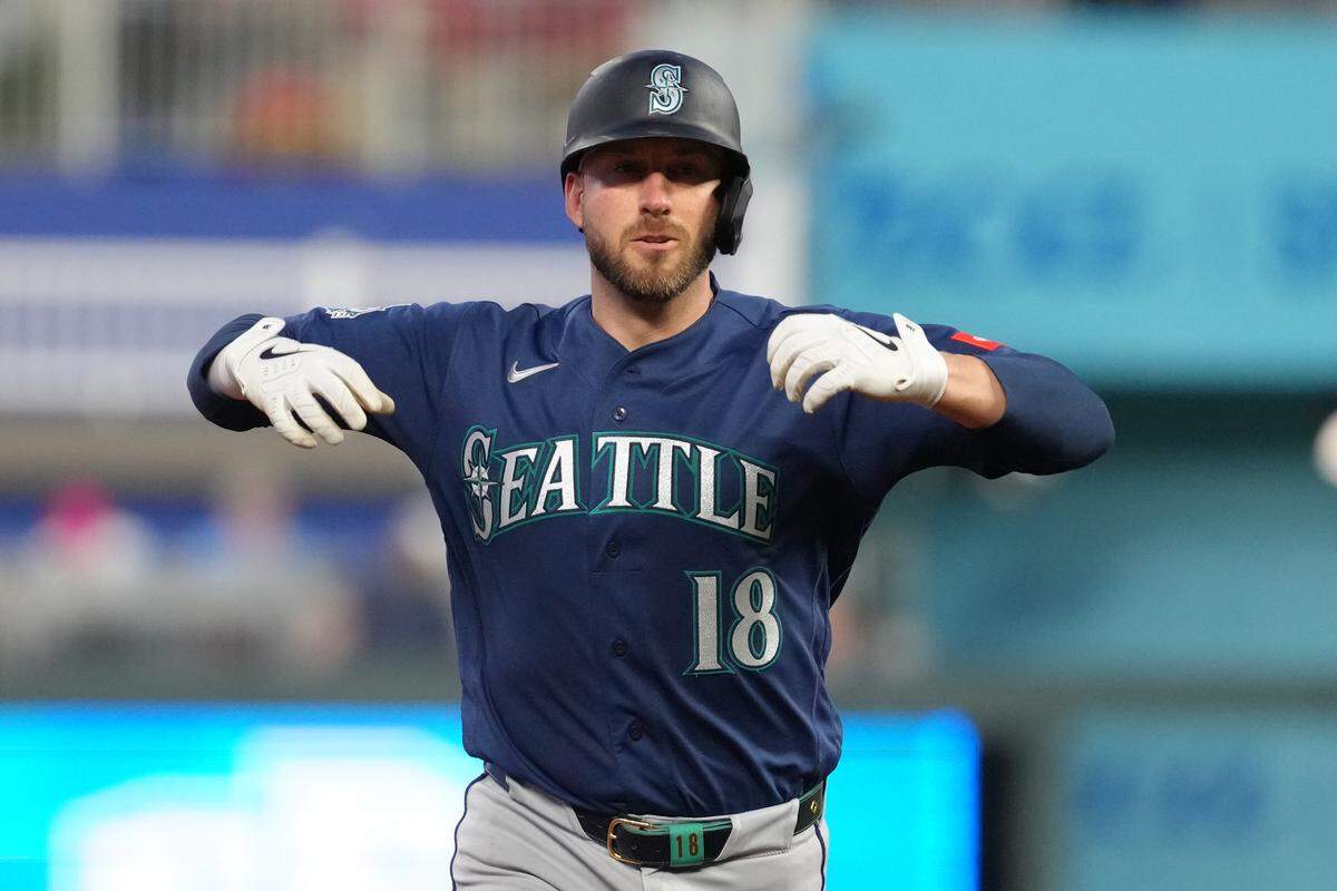 Mitch Garver #18 of the Seattle Mariners celebrates his two-run home run against the Kansas City Royals in the seventh inning at Kauffman Stadium on May 22, 2026 in Kansas City, Missouri.