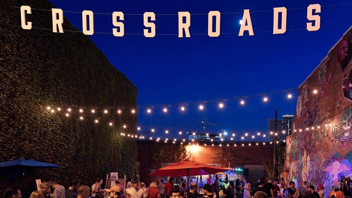 As live music filled the air in this nook in the east Crossroads, First Friday goers mingled along 18th Street.