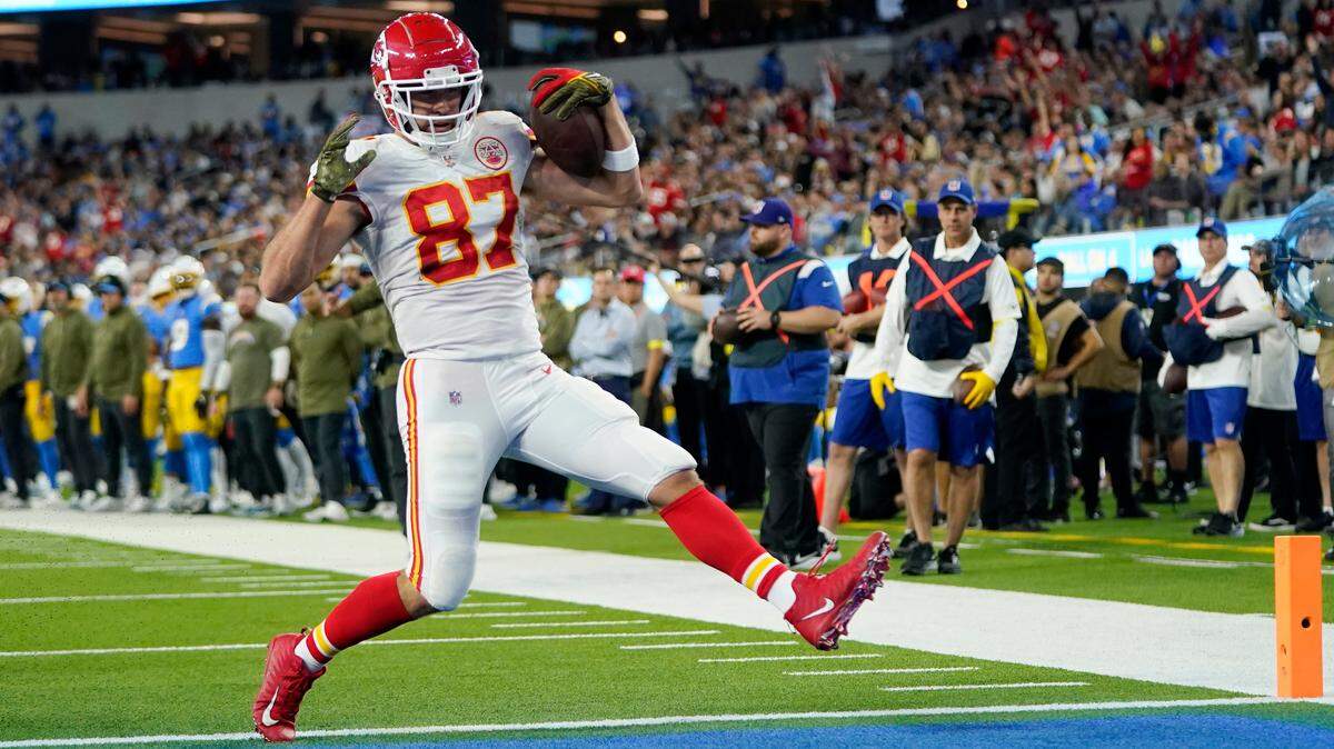 Kansas City Chiefs tight end Travis Kelce runs in for a touchdown during the first half of an NFL football game against the Los Angeles Chargers Sunday, Nov. 20, 2022, in Inglewood, Calif.