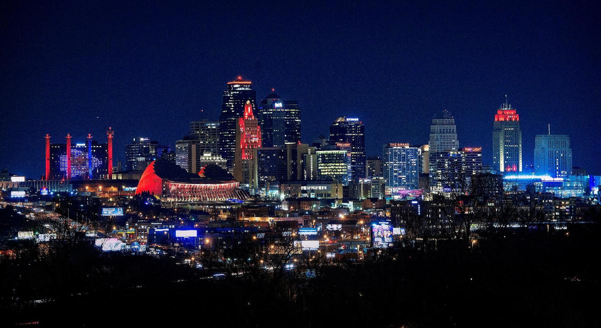 The Kansas City skyline is dotted with buildings lit in red or with Kansas City Chiefs logo on them to celebrate the team making it to Super Bowl LV.