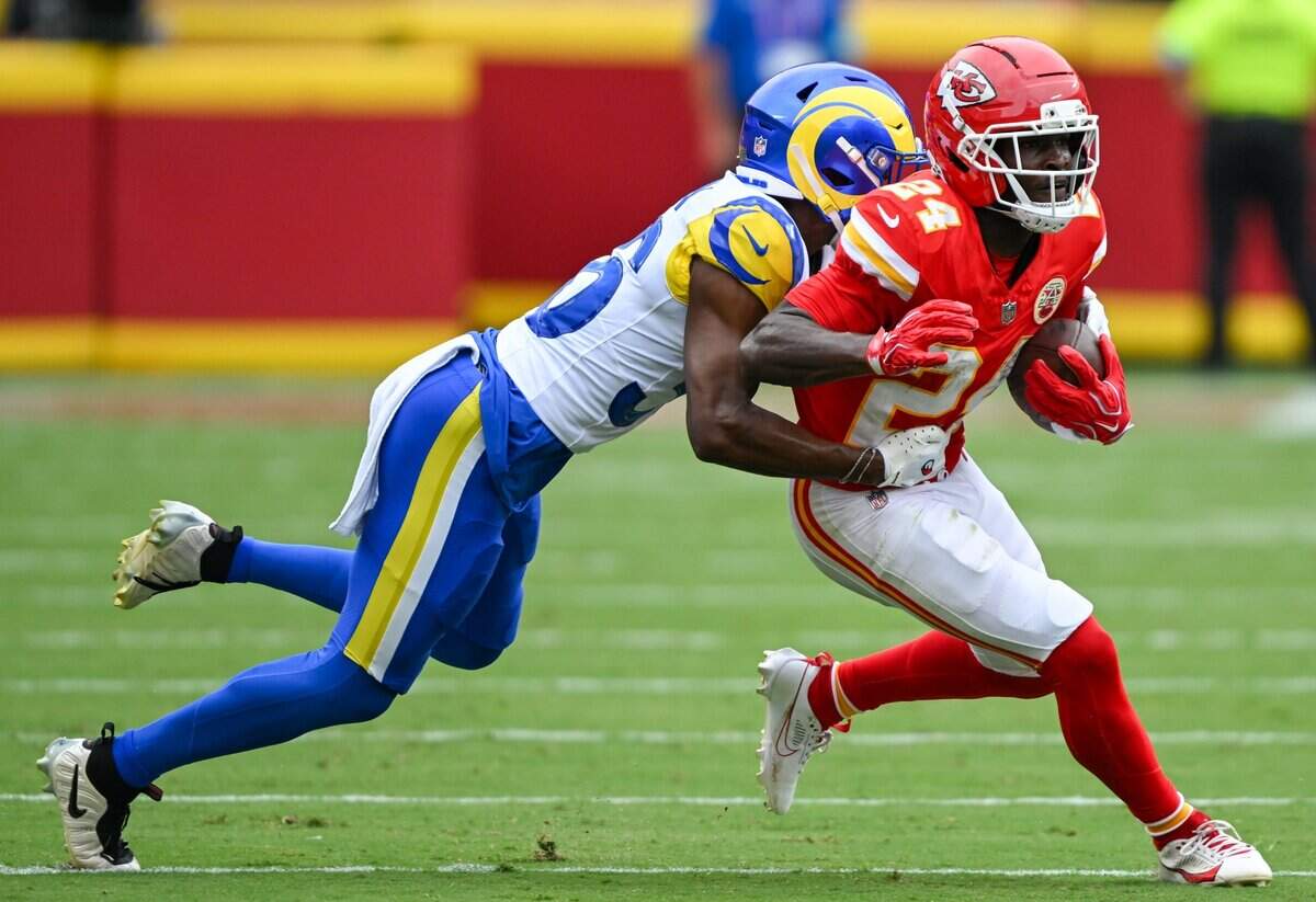 Kansas City Chiefs running back Brashard Smith (24) is tackled by Los Angeles Rams cornerback Alex Johnson (36)in the first quarter of the Kansas City Chiefs vs. Los Angeles Rams preseason game at Arrowhead Stadium in Kansas City on Aug. 15, 2026.