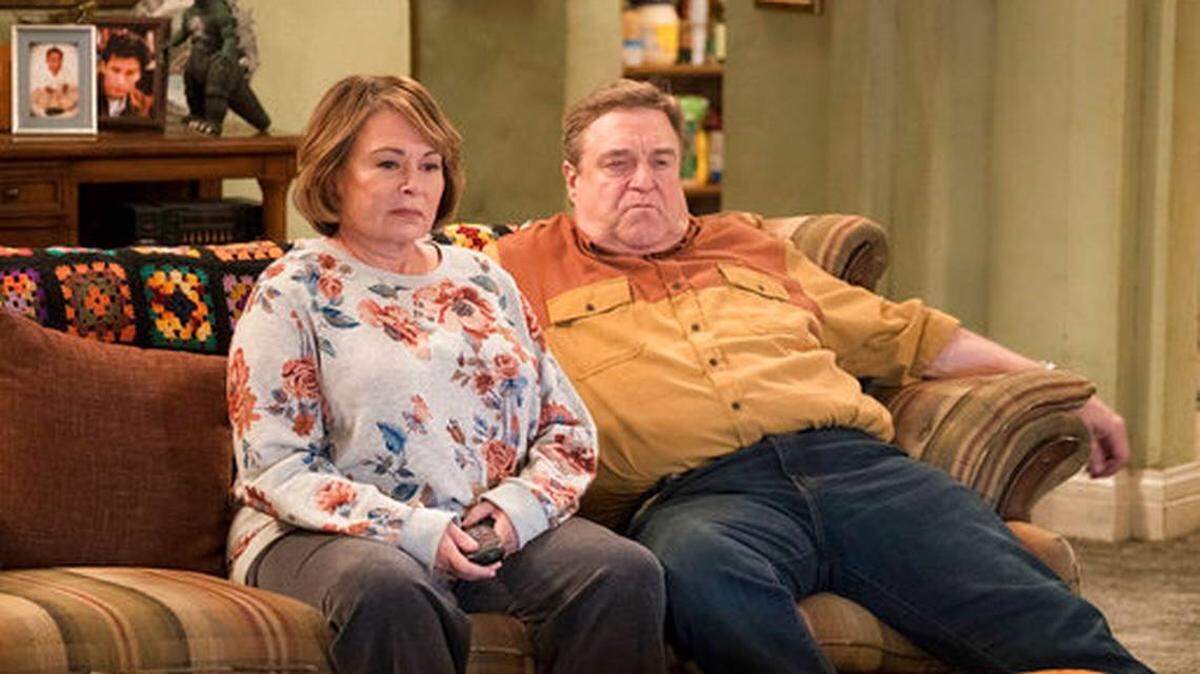 Roseanne Barr, left, and John Goodman appear in a scene from the reboot of "Roseanne," which premiered on Tuesday.