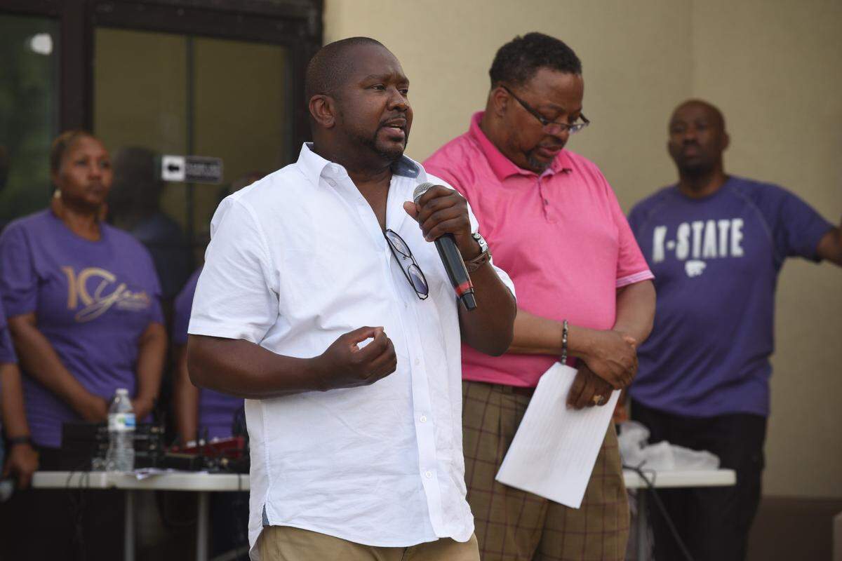 Damon Daniel, president of Kansas City’s Ad Hoc Group Against Crime, spoke during a prayer vigil Friday held outside the Greater Metropolitan Church of Christ at 37th Street and Prospect Avenue at the close of a daylong event aimed at reducing violence.