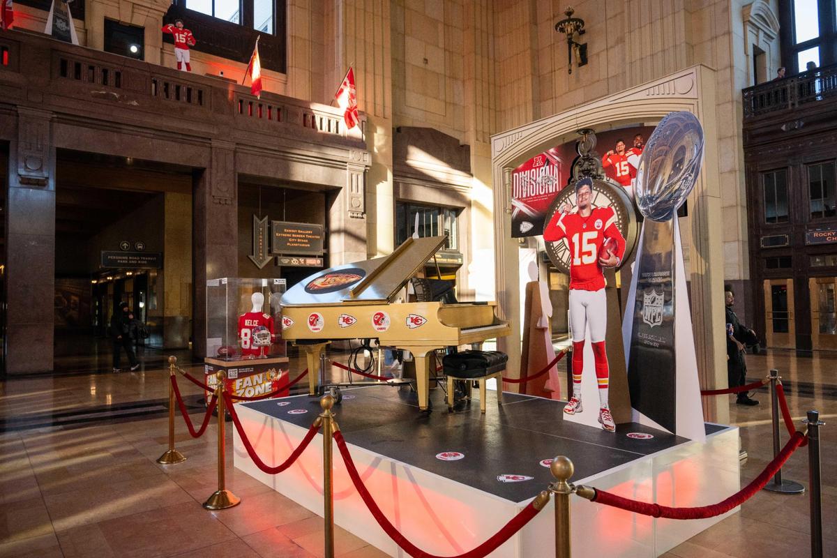 The Glitz, Glam and Gold Grand Piano is one of the Chiefs-themed attractions on display at the Chiefs Fan Zone at Union Station.