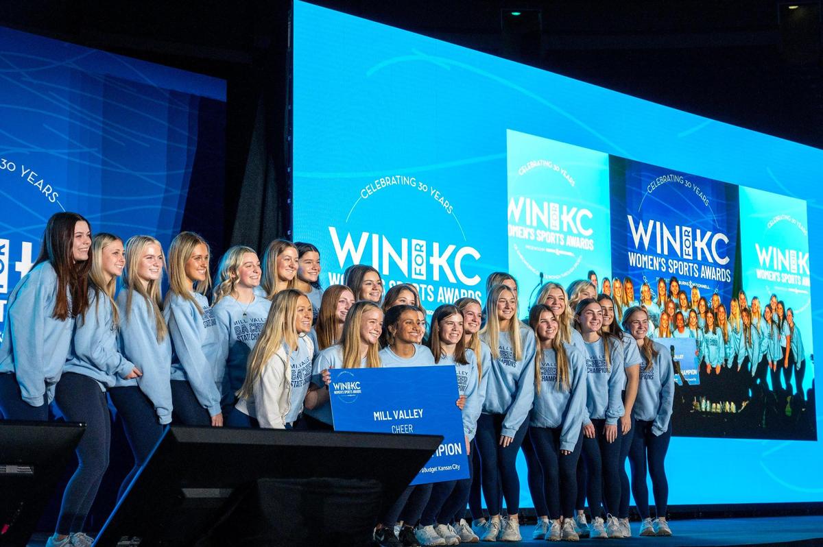 The Mill Valley High School cheer team poses for photos while being honored at the luncheon for the Win for KC Women’s Sports Awards at the Municipal Auditorium on Tuesday, Jan. 30, 2024, in Kansas City.