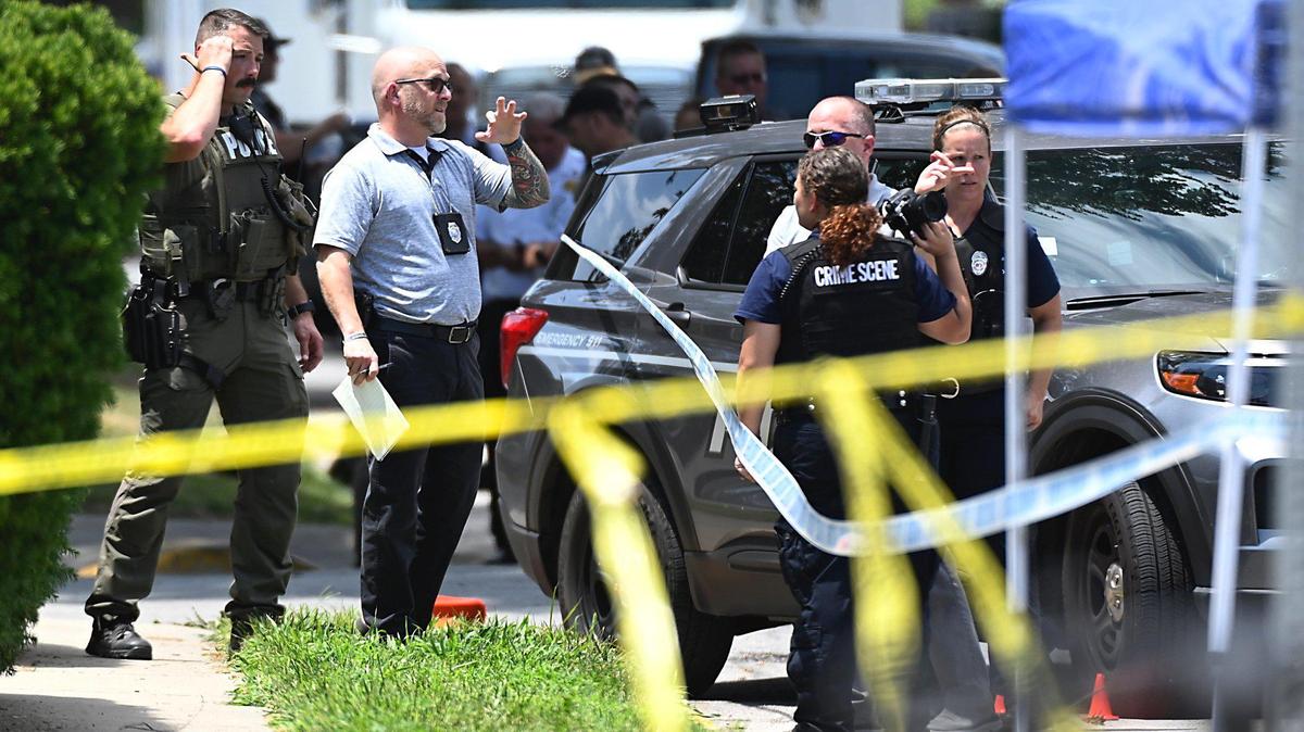 Law enforcement investigated the scene near 21st and Clay Streets in North Kansas City Tuesday after a North Kansas City police officer was shot during a traffic stop. The Missouri Highway Patrol has issued a blue alert with a description and license plate number of a gray car that fled the scene of the shooting.