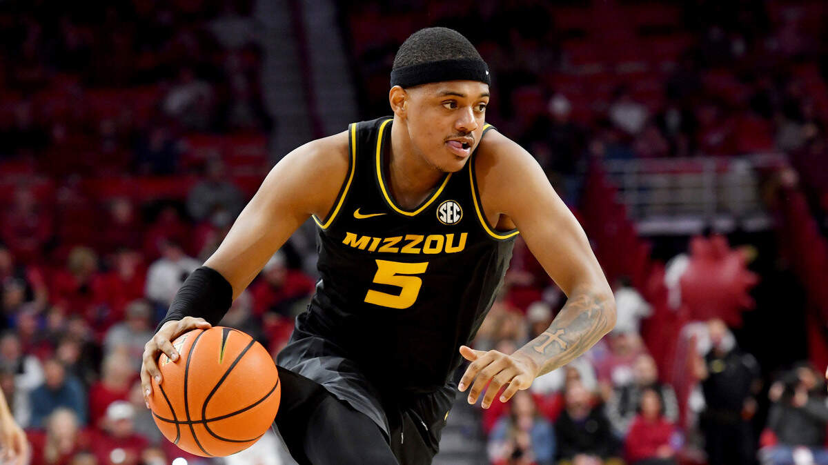 Missouri guard Jarron Coleman (5) runs a play against Arkansas during an NCAA college basketball game Wednesday, Jan. 12, 2022, in Fayetteville, Ark. (AP Photo/Michael Woods)