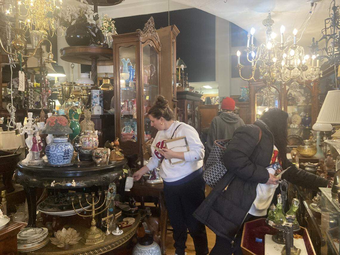 Shoppers inside the antiques building at 4501 Genessee St. on March 11, one of two days that the building, once owned by the late Melvin Dwain Smith, was reopened to the public.