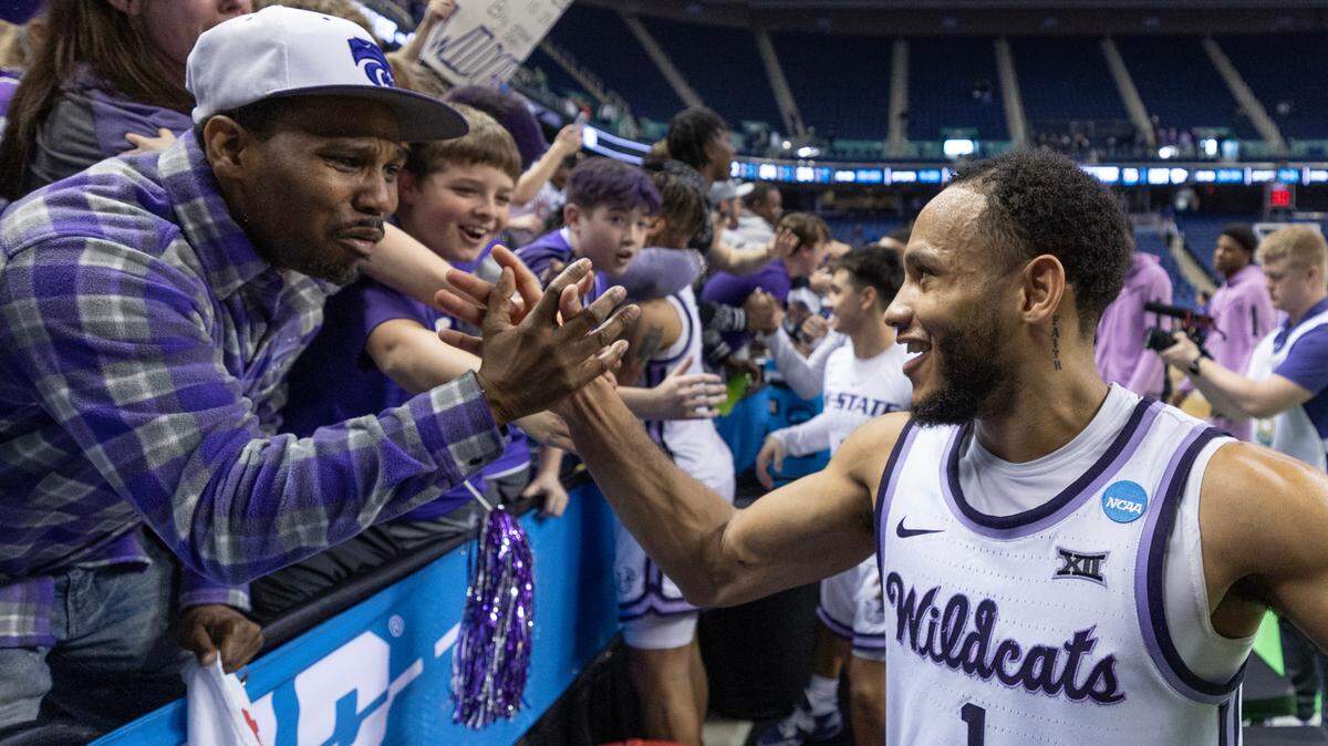 Kansas State’s Markquis Nowell celebrates with fans after the Wildcats secured a spot in the Sweet 16 on Sunday with a win over Kentucky.